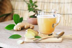 a cup of tea and some ginger on a table