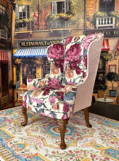 a floral chair sitting on top of a rug