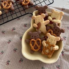 some cookies and pretzels are in a bowl