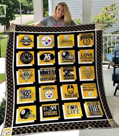 a woman is holding up a quilt that has pittsburgh football patches on it and the words love