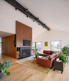 a living room with couches and a fireplace