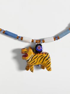 a necklace with a tiger and bead on it