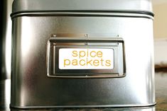 a metal box with a space packets sticker on it