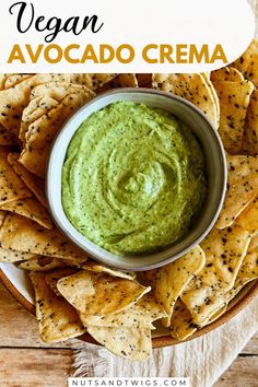 top view of a bowl of vegan avocado crema surrounded by chips. The picture is labeled with the words 'vegan avocado crema, nutsandtwigs.com'. Avocado Crema Recipe, Crema Recipe, Vegan Sauce, Avocado Crema, Vegan Yogurt, Ripe Avocado