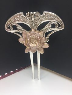 MyElegantThings By Angelina Verbuni Design Studio Art Nouveau style silver plated bronze Hair comb. This lovely baroque scroll hair comb is silver over brass. Rose is golden with the rose enameled over the brass component a dusty peach. Bold and Large this is a statement piece. You will love the high quality decorative comb, that holds the thickest and thinnest hair well. 4-1/2 x 3-1/2 inches Ornaments Diy Ideas, Bridal Hair Ornaments, Brass Jewellery Handmade, Antique Hair Combs, Decorative Hair Combs, Silver Hair Comb, Victorian Age, Hair Comb Accessories, Vintage Hair Combs