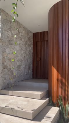 the outside of a house with stone walls and steps