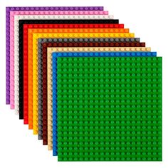 six different colors of legos are shown in this image, including green, yellow, and purple