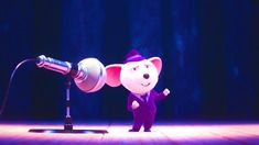 a cartoon mouse is standing in front of a microphone and wearing a purple suit with ears