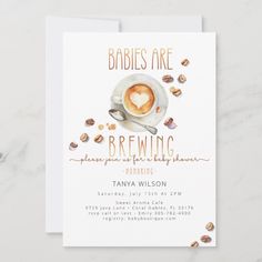 a card with a cup of coffee and nuts on it that says babies are brewing