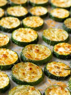 cooked zucchini on a baking sheet ready to be baked in the oven for dinner