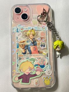 a phone case with an anime character keychain attached to the back of it