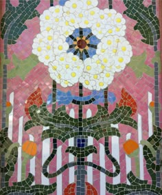 an artistic mosaic design with flowers on it