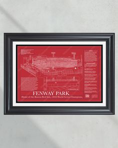 a red and black framed print of fenway park