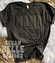 *Please read full description Black Leopard Mama Shirt, Black On Black, Puff Print, Puffy Letters, Popular, Graphic Tee, Viral, Mama Shirt, Mom Shirt, Gift You will receive: 1 - Unisex sized shirt with the above design    About this item: -This design is a puff vinyl transfer  -Machine washable, turn garment inside out, cold water -If you have any questions feel free to message me! Mama Shirts Sublimation, Leopard Mama Shirt, Puffed Vinyl Shirt, Mama Tshirt Design, Black Puff Vinyl On Black Shirt, Black On Black Puff Vinyl, Mama T Shirt Ideas, Puffy Vinyl Shirt, Puff Vinyl Designs