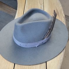 Lovely Bird Verona Hat. Classic Felt Fedora In Chambray Blue. Stiff To The Touch And Accent With A Distressed Grosgrain Ribbon And Feather. 4 Inch Brim. Size Large.... 23-24 Inch Circumference Only Worn Twice. This Color Is Really Cool And A Mix Of Blue And Grey. Looks Amazing With Denim. Last Two Pics Show Up Lighter Than Actual Color. Bird Accessories, Large Hats, Felt Fedora, Blue And Grey, Show Up, Grosgrain Ribbon, Verona, Chambray, Fedora