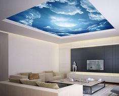 the living room is decorated in white and has a blue sky painted on the ceiling