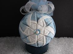 a blue and white ornament sitting on top of a table