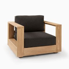 a chair that is made out of wood and has black fabric on the armrests