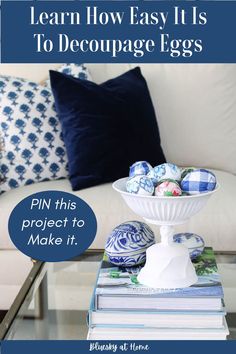 a white couch with blue and white decorations on it