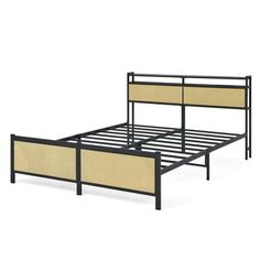 a metal bed frame with two beige headboards and an open foot board on the bottom