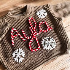 a sweater with candy canes and snowflakes on it