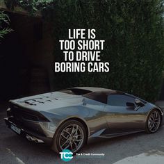 a silver sports car parked in front of a green bush with the words life is too short to drive boring cars