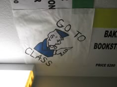 there is a sign on the ceiling that says go to class