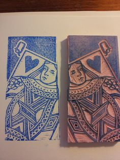 two wooden stamps sitting next to each other