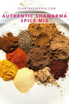 a white plate topped with lots of different types of spices on top of each other