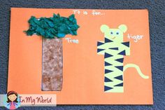 an orange paper card with a tree and tiger on it