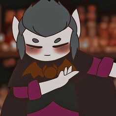 an animated image of a woman with dark hair and horns holding something in her hands