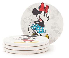 mickey mouse coasters stacked on top of each other in front of a white background