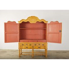 an old fashioned dresser with two doors open