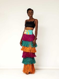 Cynthia Otiyo-Abila founded her eponymous brand in 2016 to bridge the gap between traditional Nigerian craftsmanship and empowered modern glamour. This skirt has a playful tiered silhouette hand-sewn from panels of artisanally dyed raffia. The color-block design encapsulates the joyful mood of the season—style it with a tonal sweater or your favorite tee. - High waist, ankle length, back zip fastening - Raffia - Crafted using natural and organic materials, with a focus on sustainable practices a Raffia Crafts, African Luxury, Andrea Iyamah, Lagos Fashion Week, Color Block Skirt, Red Carpet Ready, Only Fashion, Skirted Swimwear, Daily Look