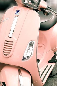 a pink scooter with the word truelle on it's side and pictures of other items