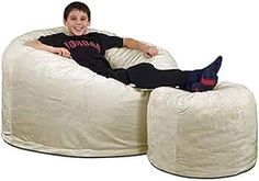 a man sitting on a bean bag chair