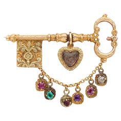 Love for Ever Magnificent little treasure as survivor of a past pledge of love will please the next keeper with its un discussed beauty and hidden secret tales of love Georgian period from the early 19th Century, this ‘ key to my heart’ brooch prizes the majestic Georgian workmanship – tests 18 KT solid gold Horizontal key is hand chased with all motifs dear at the time – with a sweet hanging heart keeping sealed blonde hair in it A gold chain holds six gemstones spelling the word REGARD as sentimental acrostic jewellery The brooch is complete with no sign of repair very well kept and fantastic condition Rare and beautiful addition to any lover or collector Gemstone are close back 18kt and silver – Ruby, Emerald, garnet, amethyst, Ruby, Diamond Measures: 33 x 40 mm. English origin Further Platinum Chain, Georgian Jewelry, Art Deco Necklace, Garnet Jewelry, Diamond Brooch, Key To My Heart, Heart Brooch, Hanging Hearts, Jade Jewelry