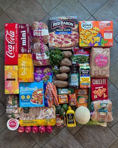 a variety of food is laid out on the floor to be used as a display