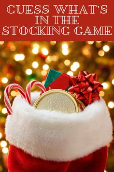 a christmas stocking filled with candy canes and candies, in front of a christmas tree