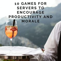 a glass of wine sitting on top of a table with the words 10 games for servers to engage productivity and morale