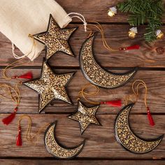 * Set of three black and gold moon ornaments * Festive gold decor for christmas * Handpainted gold mistletoe pattern on black color * Ready to hang gold thread loop with red tassel * Large moon - 3.75" height, 1" width * Medium moon - 3.25" height, 1" width * Small moon - 2.75" height, 1" width * Includes a dust bag * Traditional craft using paper pulp * Made in Kashmir, India --------------------------------- Paper mache craft of Kashmir is the art of creating art from paper pulp. Paper pulp is Kashmir Paper Mache, Mistletoe Pattern, Marble Rolling Pin, 3 Moon, Paper Mache Christmas, Gothic Christmas, Pulp Paper, Pink Basket, Intricate Art