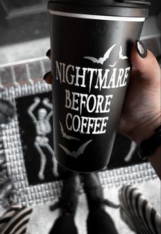 a person holding a coffee cup with the words nightmares before coffee