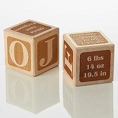 two wooden cubes with the number six and twenty seven on them, one is brown