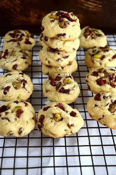 a bunch of cookies sitting on top of a cooling rack