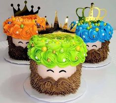 three cakes decorated with crowns and beards on top of each other in the shape of people's heads