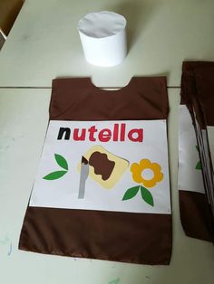 a nutella bag sitting on top of a table next to a cup and spoon