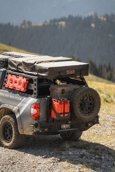 an off road vehicle parked on the side of a mountain