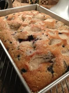 a loaf of blueberry bread cooling in the oven