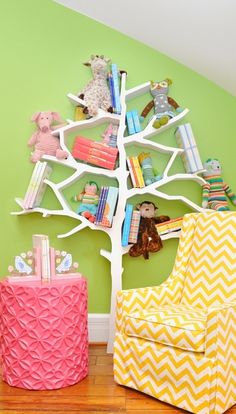 there is a tree with books and toys on it