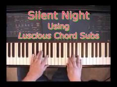 someone is playing the piano with their hands on top of it and text reading silent night using